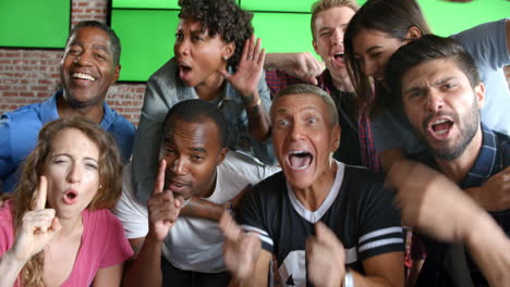 friends watching game in sports bar on screens shot on r3d