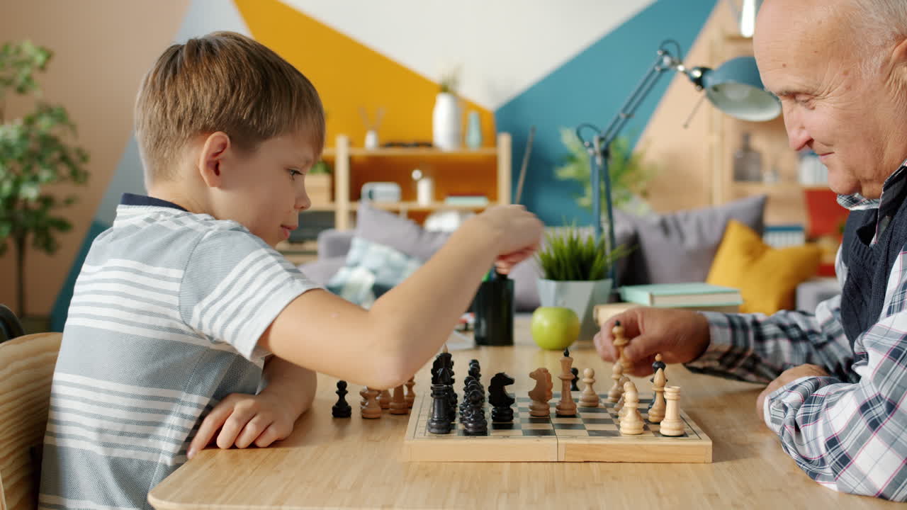 Grandfather and Grandson Playing Chess