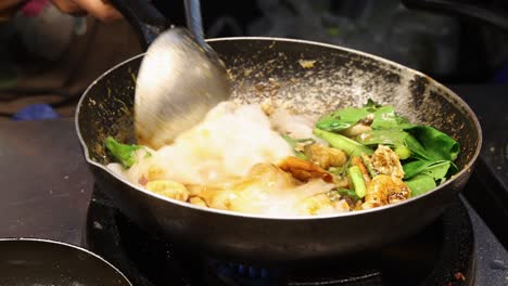 fresh thai food frying in pan