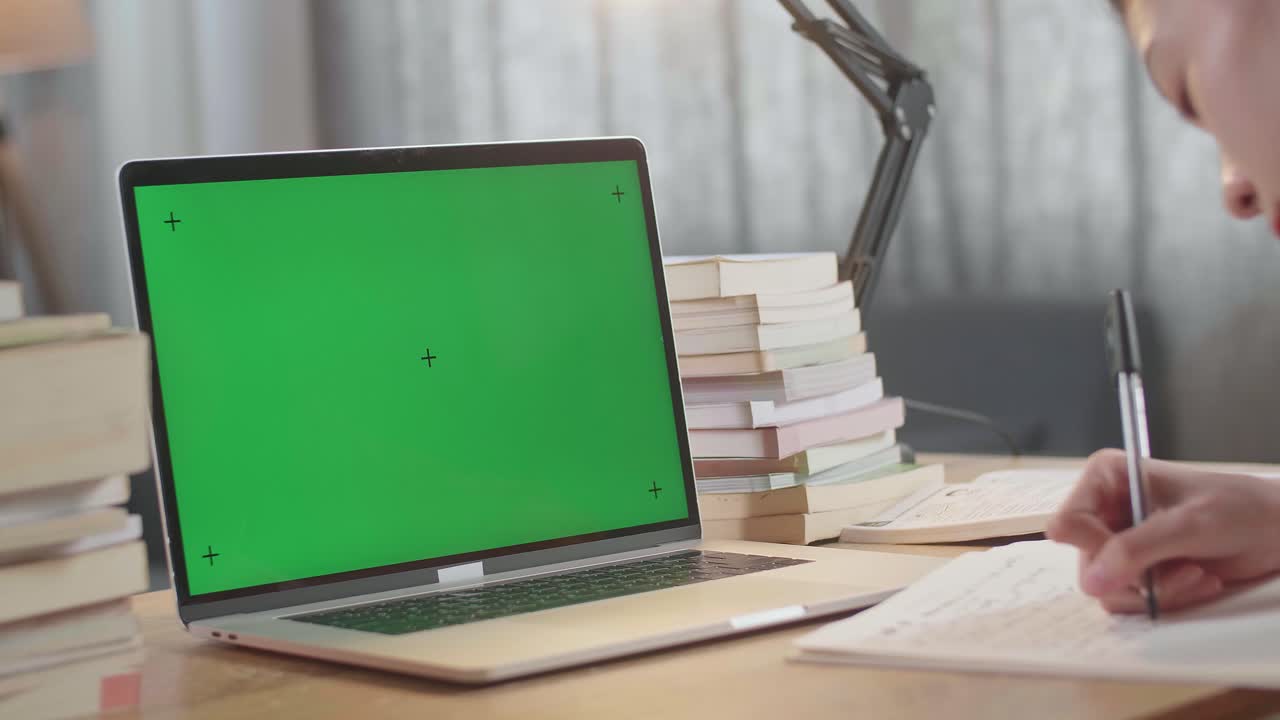 Student Studying with Laptop and Notebooks