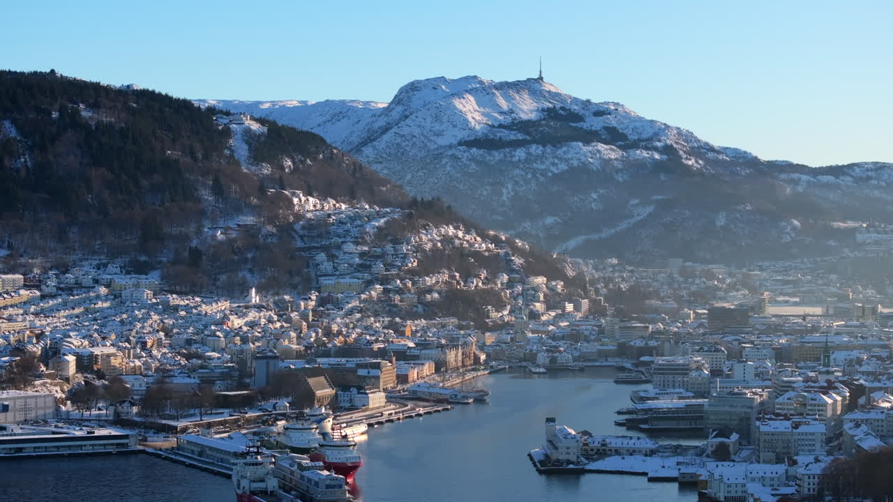Bryggen and the historic city centre in Bergen covered in snow on a sunny winter day