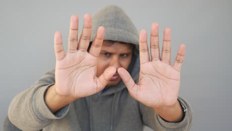 person blocking view with hands