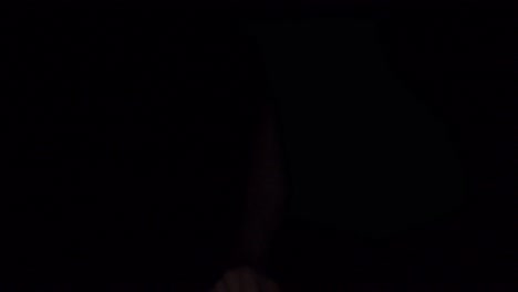 hand reaching out in the dark