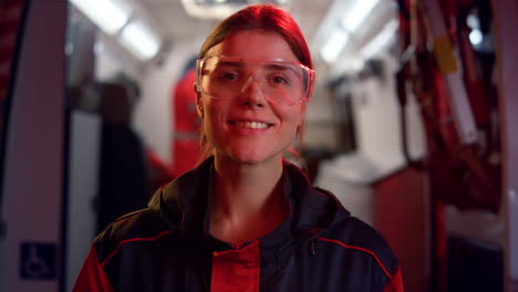 woman in medical uniform looking at camera