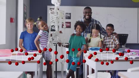 Animation-of-dna-strand-over-smiling-african-american-male-teacher-and-pupils-with-skeleton-in-class
