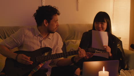 musicians collaborating on songwriting