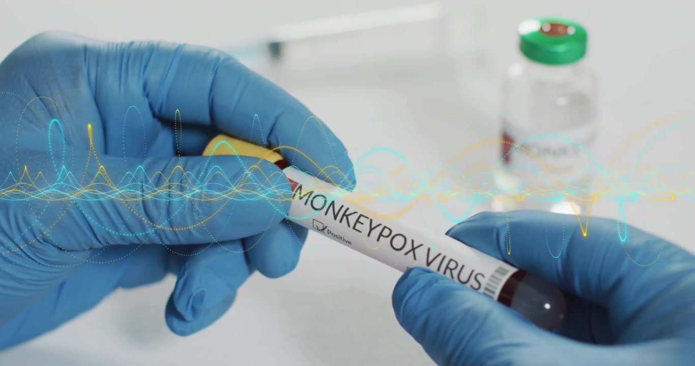 Lab tech picking up yellow cap tube rotating to show MONKEYPOX label as waveform overlay drifting