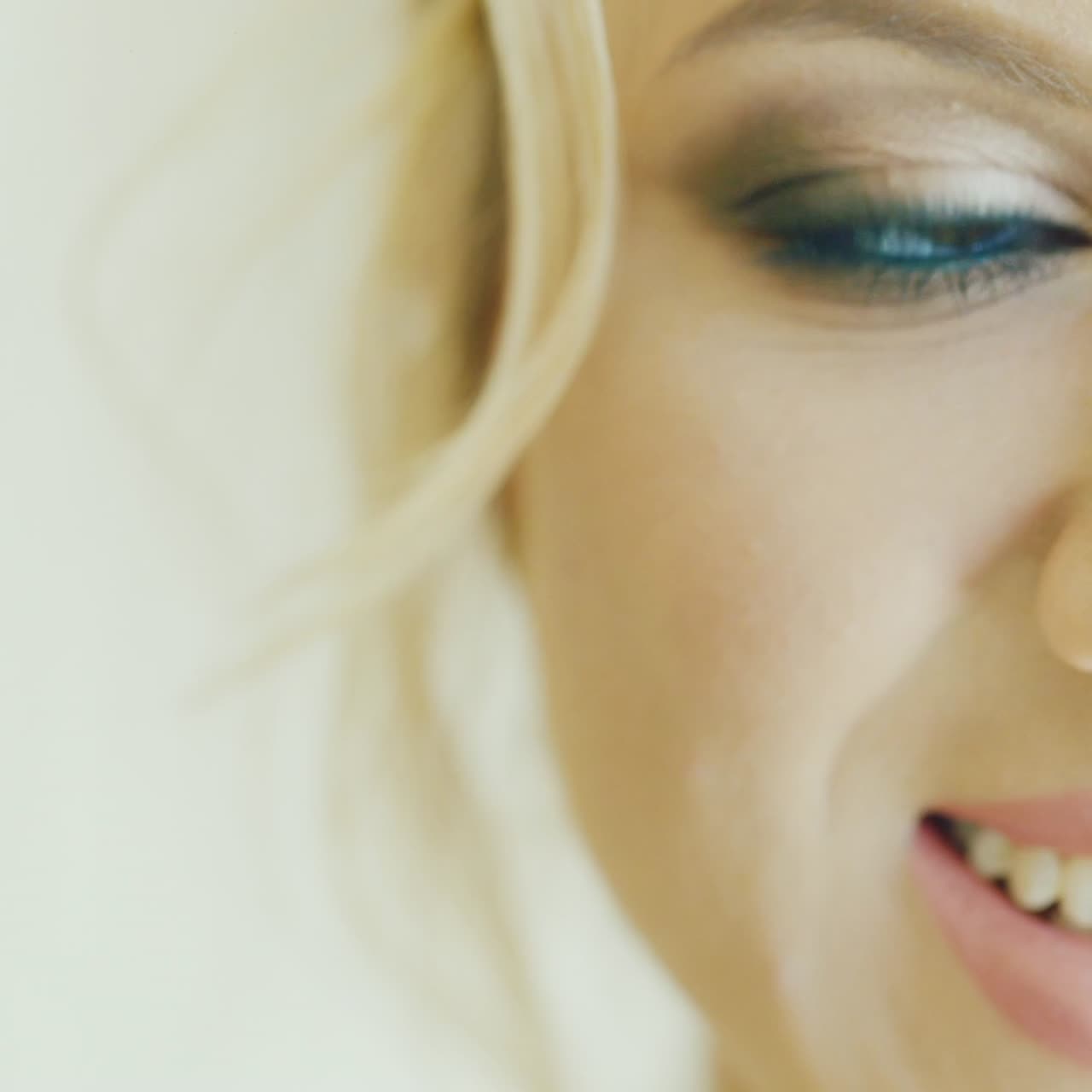 Attractive Blonde Bride Doing Makeup 2