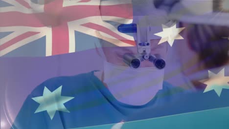 Animation-Der-Australischen-Flagge-über-Einem-Kaukasischen-Arzt,-Der-Eine-Lupe-Verwendet-Und-Eine-Operation-Durchführt