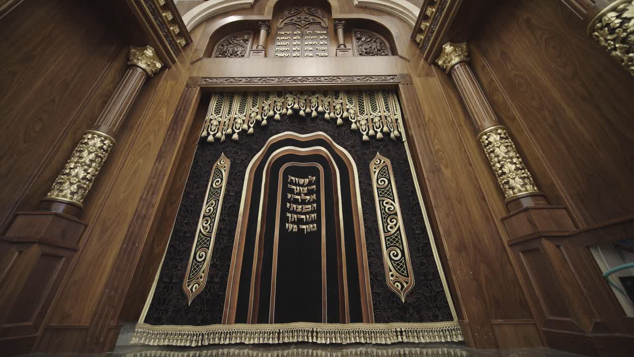 Ornate Aron Kodesh (Torah Ark) in Synagogue with Detailed Carvings and Hebrew Inscriptions