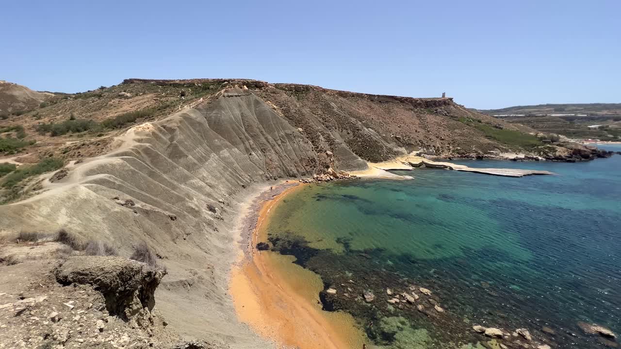 Mediterranean Island with rugged landscape. Secluded Bay in Malta with steep ridge