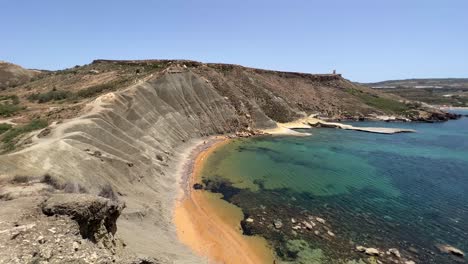 mediterranean island with rugged landscape. secluded bay in malta with steep ridge