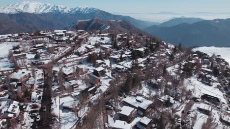 aerial view of farellones village road and houses during winter in lo barnechea, santiago, chile