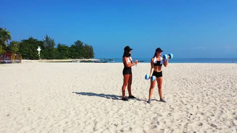 colorful landscape on paradise beach with white sand near blue sea where beautiful girls exercising gymnastics on fresh air of morning in malaysia