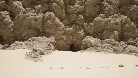 a cave entrance in a desert landscape