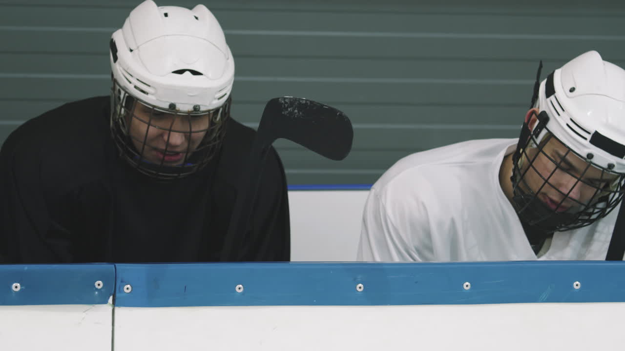Hockey Players Sitting On Tribune Talking
