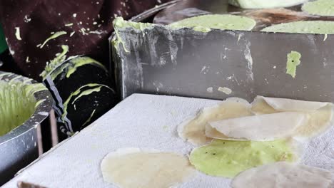 preparing a colorful thai cotton candy crepe.