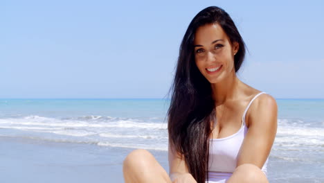 Portrait-of-Woman-Sitting-in-Sunshine-on-Beach