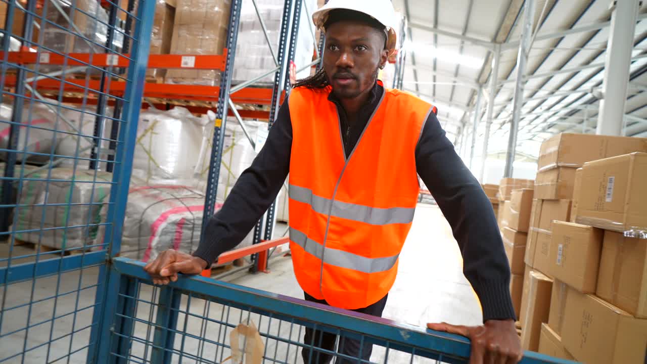 Warehouse worker pushing a cart