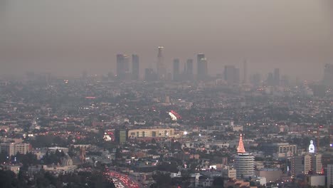 Panorama-or-long-shot-of-downtown-Los-Angeles-in-the-evening-with-smog-a-few-weeks-before-Christmas,-California,-USA