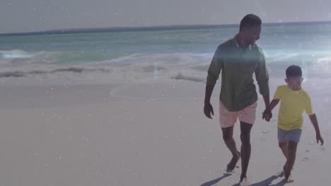 Animation-Von-Lichtspuren-über-Einem-Afroamerikanischen-Mann-Und-Seinem-Sohn,-Die-Am-Strand-Spazieren-Gehen
