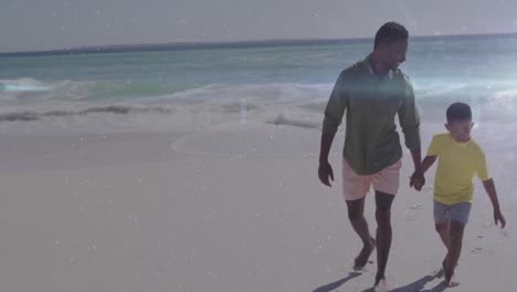 Animation-of-light-trails-over-african-american-man-and-his-son-walking-at-beach