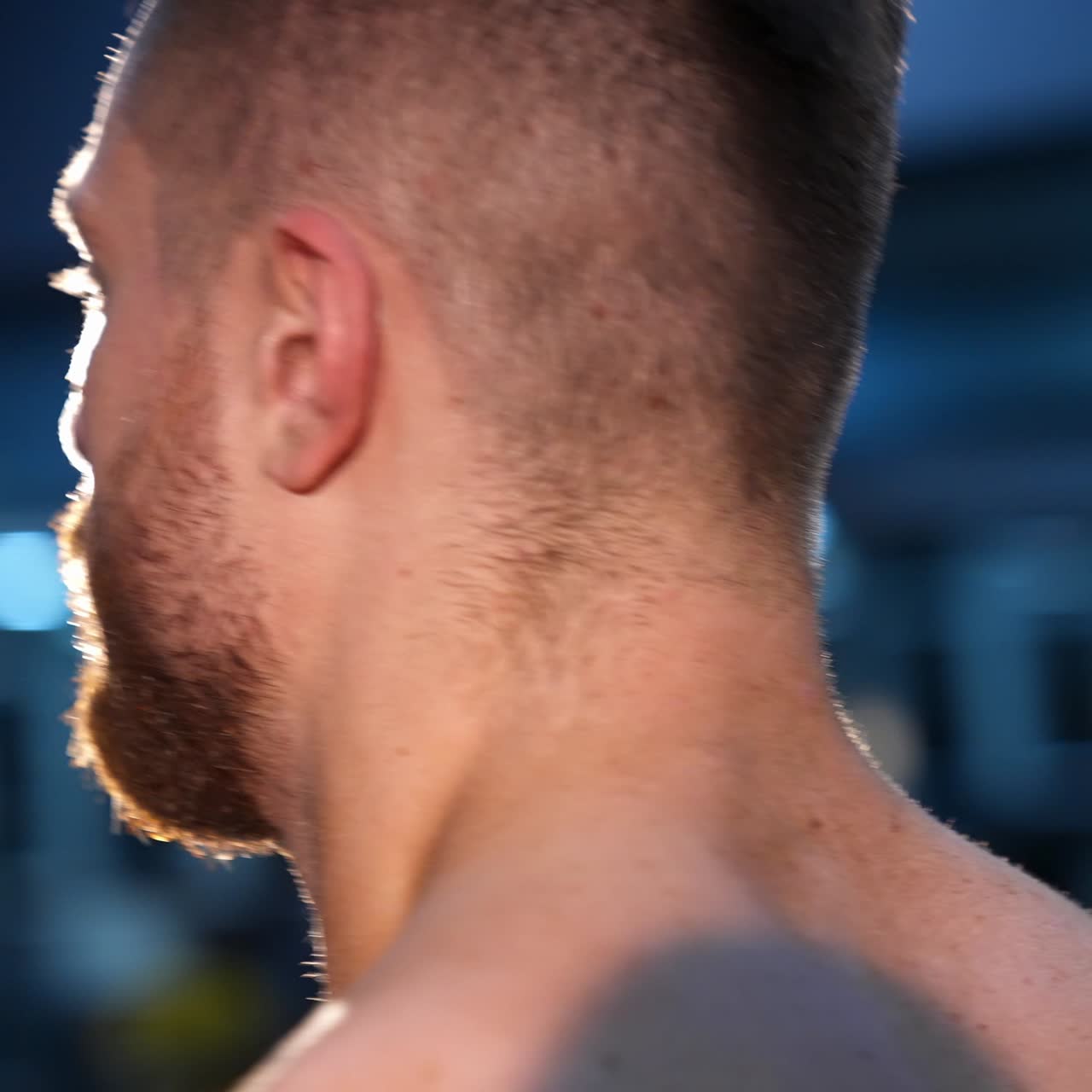 Circle view on handsome male bodybuilder with strong body and perfect abs. Male with naked torso. Slow motion