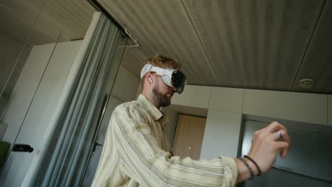 man experiencing virtual reality in modern apartment