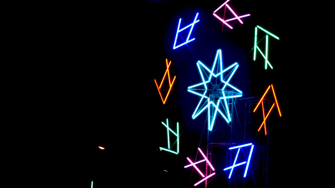 Neon fish light is spinning