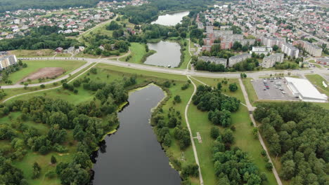 Living-district-of-Jonava-city-surrounds-small-water-ponds,-aerial-drone-view