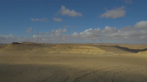 aerial: dolly in fly over negev desert, israel