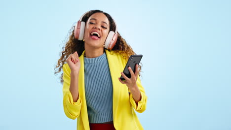 Dance,-headphones-and-woman-with-phone-in-studio