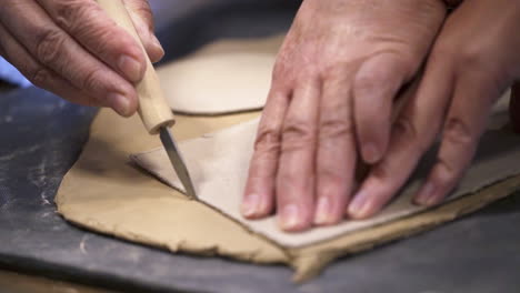 elderly people working with clay