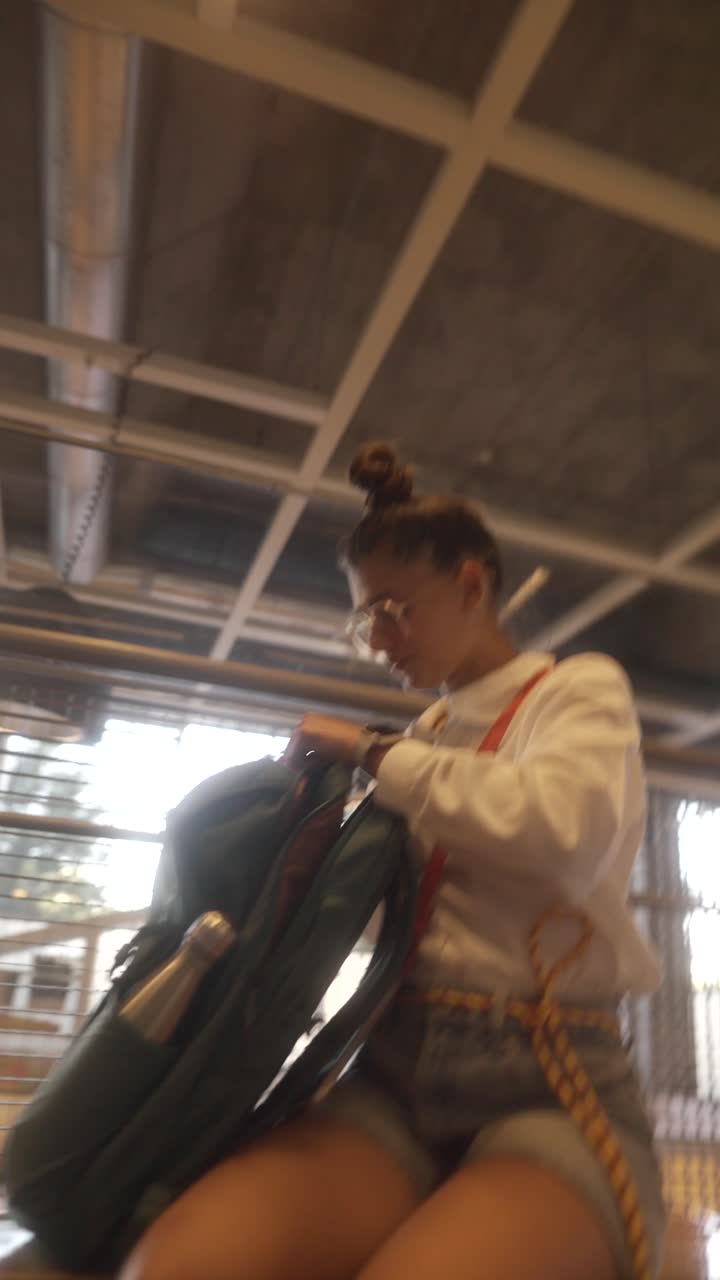 Woman packing a backpack