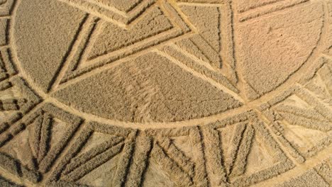 overlapping west meon mysterious crop circle pattern aerial view descending low above farmland