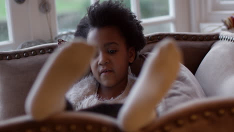 girl lying on sofa reading book shot on r3d