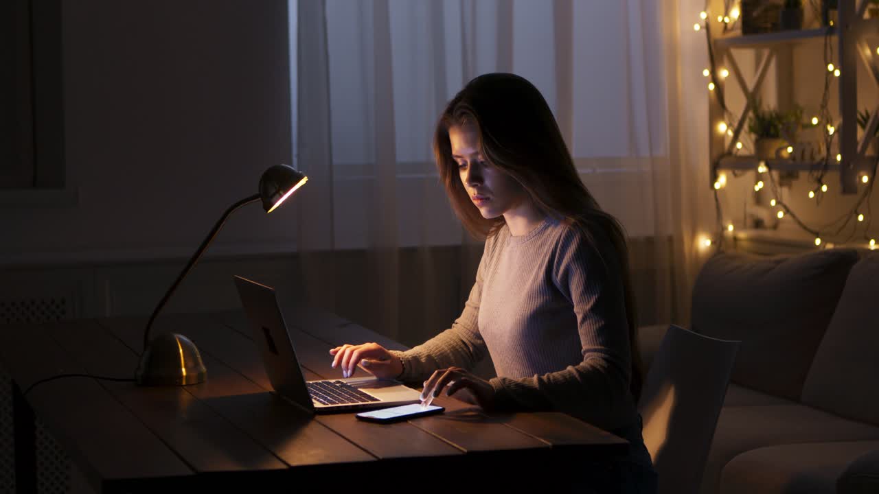 Woman studying late night at home