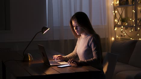 woman studying late night at home