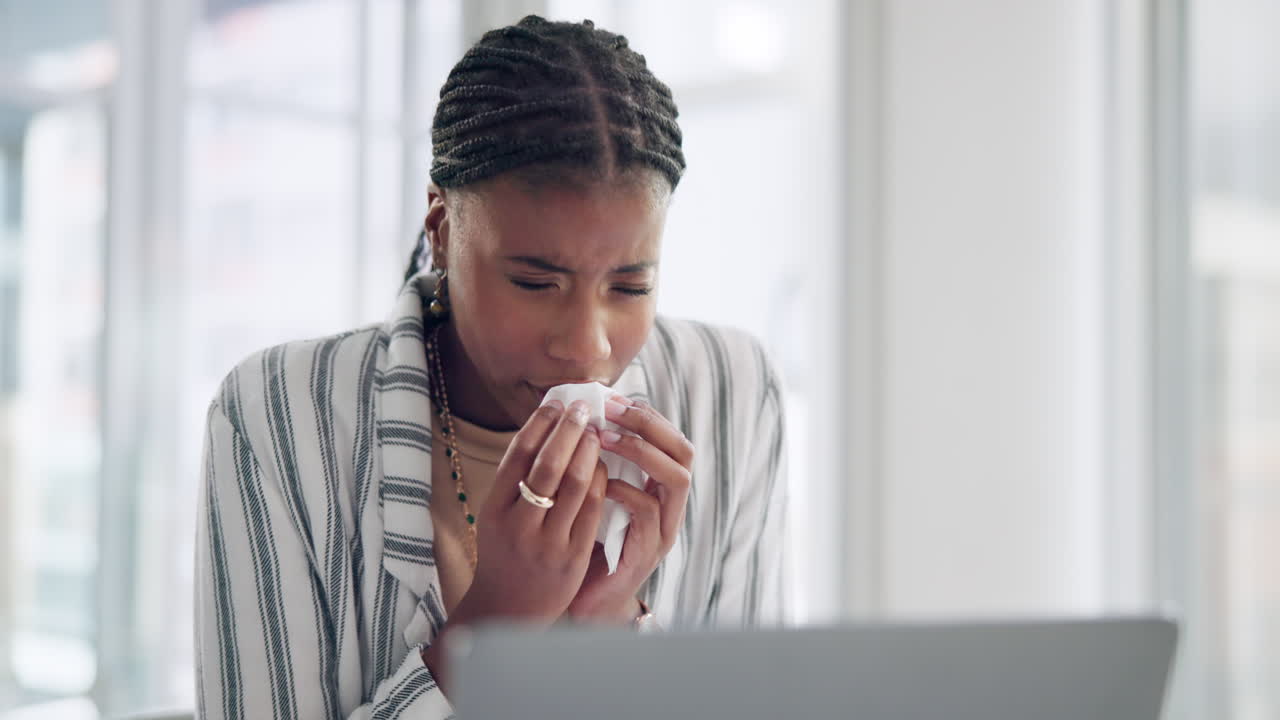 A woman feeling unwell at work