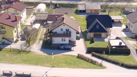 traditional villa houses along street in village, slovenia, top, aerial