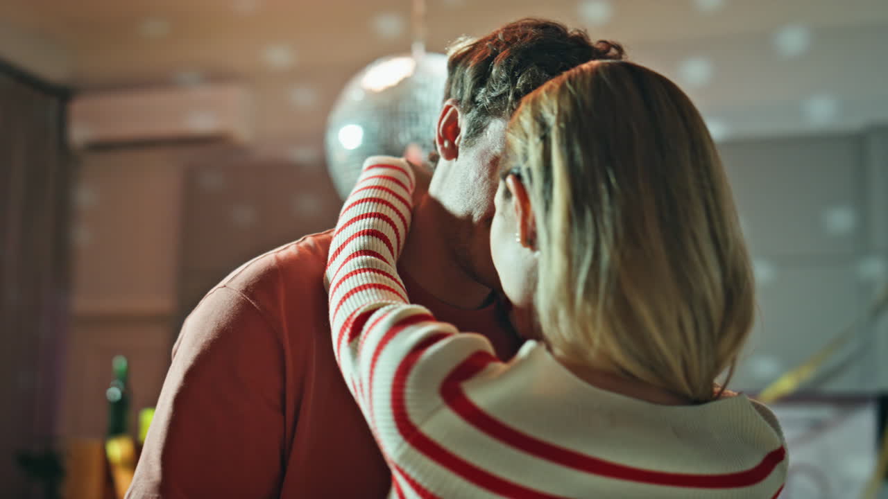 Romantic couple dancing disco ball closeup. Tender soulmates hugging after party