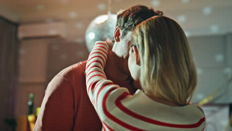 romantic couple dancing disco ball closeup. tender soulmates hugging after party
