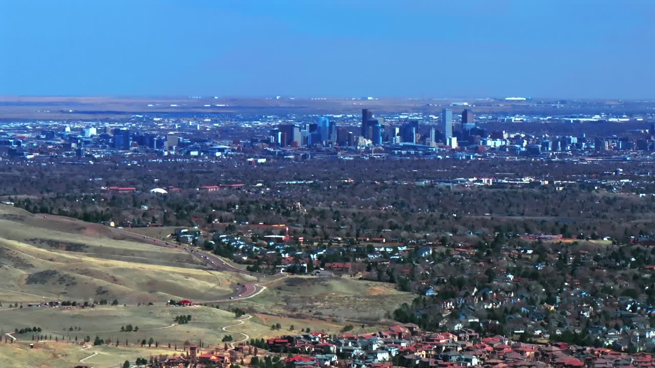Solterra Lakewood Red Rocks Park and Amphitheater Morrison Colorado aerial drone view downtown Denver front range foothills neighborhood mid winter sunny blue sky clouds parallax circle right motion