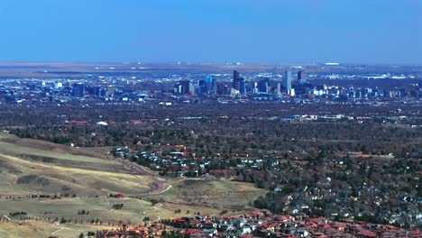 solterra lakewood red rocks park and amphitheater morrison colorado aerial drone view downtown denver front range foothills neighborhood mid winter sunny blue sky clouds parallax circle right motion