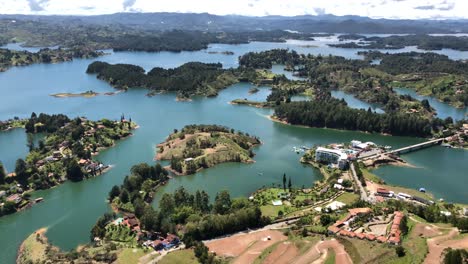 helicopter taking off at the peñol reservoir, in guatape, shot take from peñon de guatape. colombia. luxury tourism in colombia.