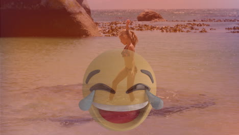 at beach, person in swimsuit with large laughing emoji animation overlay