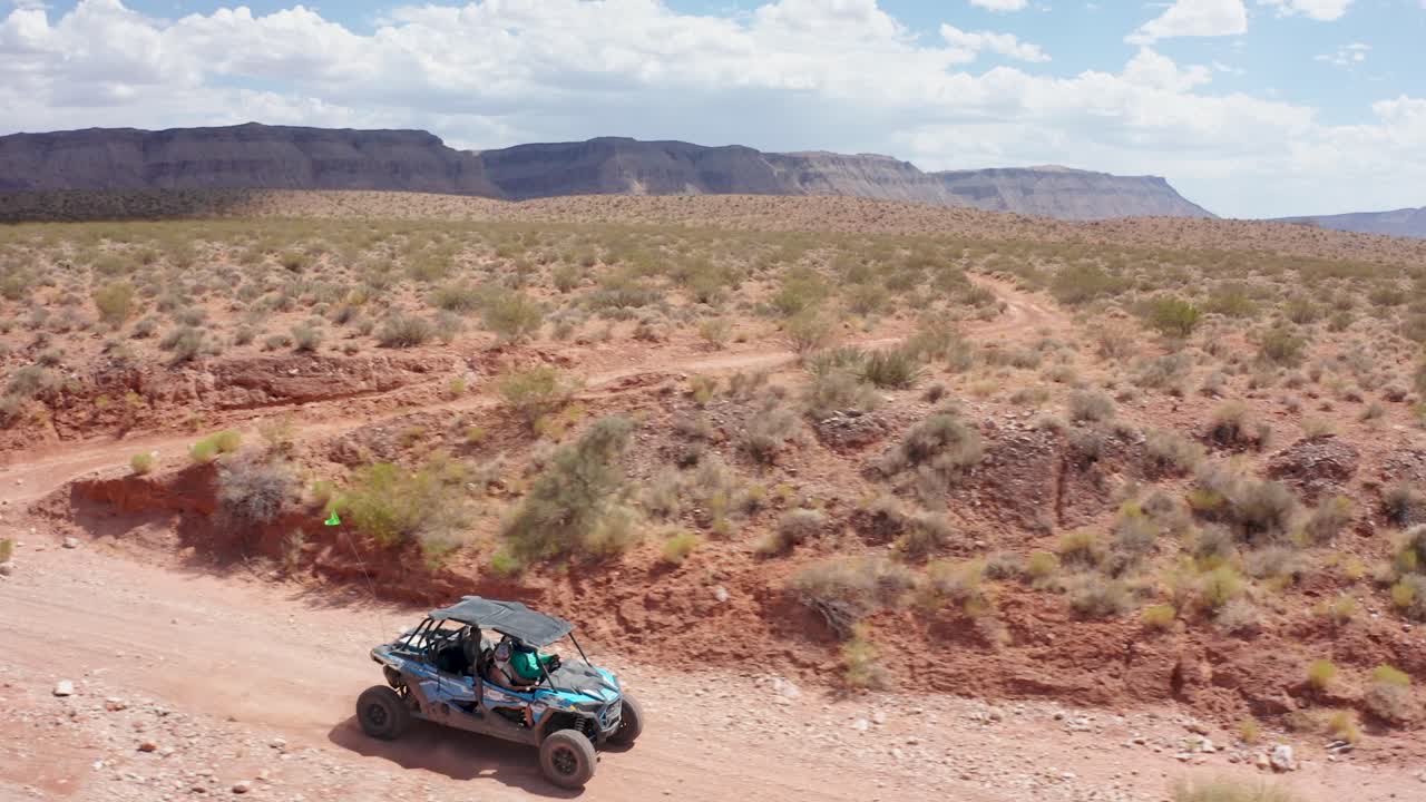Aerial of a dune buggy driving through Utah's Hurricane Valley