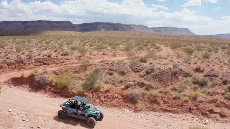 aerial of a dune buggy driving through utah's hurricane valley