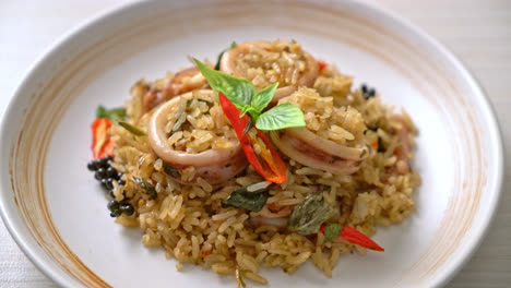 homemade basil and spicy herb fried rice with squid or octopus - asian food style