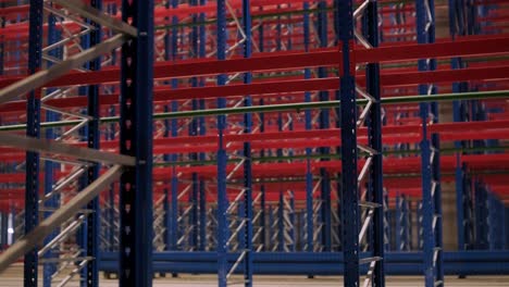 big and modern warehouse under construction, featuring metal shelving and other industrial equipment.